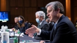 Direktor FBI-a Christopher Wray svjedoči pred povjerenstvom Senata za obavještajnu službu o svjetskim prijetnjama na Capitol Hillu u Washingtonu, u srijedu, 14. aprila 2021.