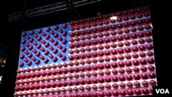 The Super Bowl is the most-watched American sporting event of the year. This American flag has been decorated with Wilson footballs, the company that manufactures every football that is used by the NFL. (B. Allen/VOA)