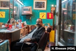 Mahmoud el-Batal, a barber, says his “yes” vote will be a service to his nation, in Cairo on April 17, 2019.