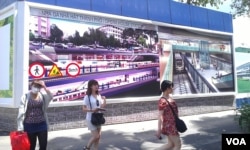 The construction banner at a future metro stop in Ho Chi Minh City. (Lien Hoang for VOA News)