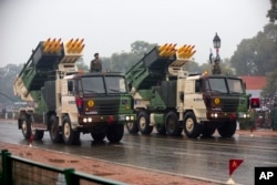 FILE - Military weapons move along the Republic Day Parade route in New Delhi, India, Jan. 26, 2015.