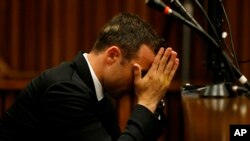 Oscar Pistorius sits in the dock in court on the third day of his trial at the high court in Pretoria, South Africa, Wednesday, March 5, 2014.