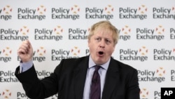 Britain's Foreign Secretary Boris Johnson wipes his forehead as he delivers a speech at the Policy Exchange in London, Wednesday Feb. 14, 2018.