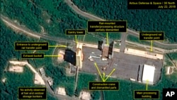 This July 22, 2018, satellite image released and annotated by 38 North on Monday, July 23, shows what the U.S. research group says is the partial dismantling of the rail-mounted transfer structure, at center, at the Sohae launch site in North Korea. 