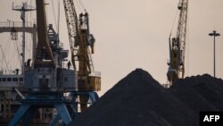 North Korean coal piled up on a dockside at the port in Rason. (File)