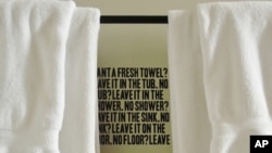 Hotel guests are reminded to save the planet, by keeping their used towels, when they step into the shower.