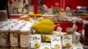FILE - A reproduction of a durian sits atop packages of durian cakes from Vietnam at a shopping mall in Beijing, Jan. 10, 2020. In September 2022, Vietnam exported its first fresh durian to China after four years of negotiations.