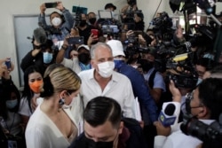 FILE - Nasry Asfura, presidential candidate for Honduras' ruling National Party, arrives at a polling station to cast his ballot during general elections, in Tegucigalpa, Honduras, Nov. 28, 2021.