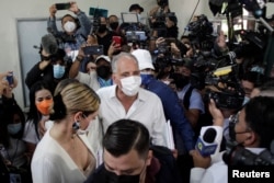 FILE - Nasry Asfura, presidential candidate for Honduras' ruling National Party, arrives at a polling station to cast his ballot during general elections, in Tegucigalpa, Honduras, Nov. 28, 2021.