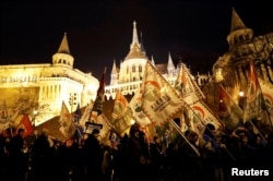 People protest after Hungarian Prime Minister Viktor Orban delivered his annual state of the nation address in Budapest, Hungary, Feb. 10, 2019.