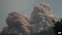  Mount Rokatenda spews volcanic material as it erupts on Palue island, Indonesia, Aug. 11, 2013.