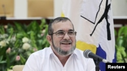 FILE - FARC rebel leader Rodrigo Londono, better known by the nom de guerre Timochenko speaks to the media during a news conference in Havana, Sept. 23, 2015.