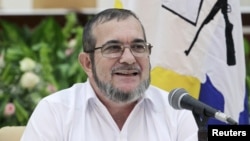 FARC rebel leader Rodrigo Londono, better known by the nom de guerre Timochenko speaks to the media during a news conference after his meeting with Colombia's President Juan Manuel Santos and Cuba's President Raul Castro in Havana, Sept. 23, 2015.