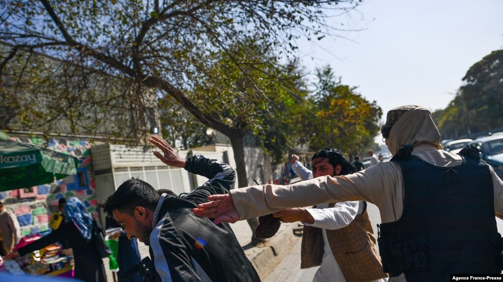 File - Taliban members violently attacked journalists during a restriction of media coverage during a women's rights protest in Kabul on October 21, 2021. (Photo by BULENT KILIC / AFP)