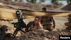 French troops take up positions in northern Mali January 19, as a French-led offensive drives al-Qaida-linked rebels from the larger towns in the region.
