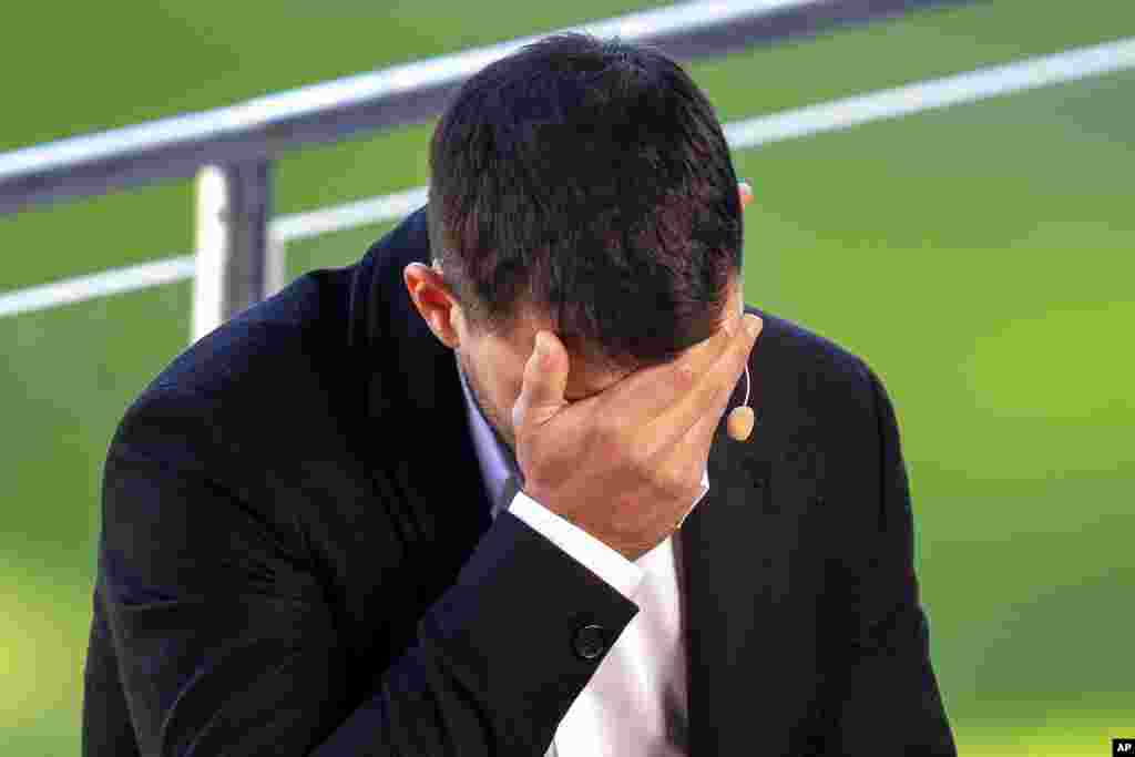 Barcelona striker Sergio Aguero cries during a press conference, after announcing his retirement from football due to a heart condition, at the Camp Nou stadium in Barcelona, Spain.