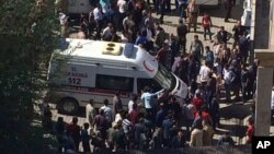 An ambulance with wounded soldiers and civilians arrives at a hospital in Semdinli, Turkey, near the border with Iraq, Oct. 9, 2016.