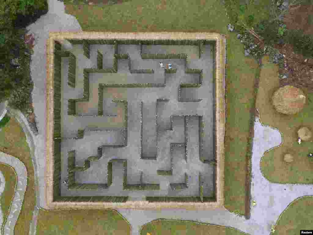 An aerial view shows visitors walking in a maze, at a tourist resort in Zunyi, Guizhou province, China.