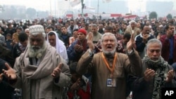 Egyptians pray during a demonstration in Tahrir Square in Cairo, Egypt, Friday, Dec. 30, 2011. Several Egyptian rights groups accused the country's ruling military council of using "repressive tools" of the deposed regime in waging an "unprecedented campa