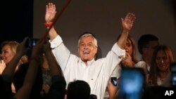 Former Chilean president and billionaire Sebastian Pinera celebrates the first official results that place him first in the elections, in Santiago, Chile, Nov. 19, 2017. 