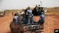 Sudanese armed forces ride a military vehicle at the oil-rich border town of Heglig, Sudan, April 24, 2012.