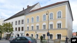 FILE - This Sept. 27, 2012, photo shows an exterior view of Adolf Hitler's birth house, front, in Braunau, Austria. Austria's lower house of parliament has approved a bill to buy it.