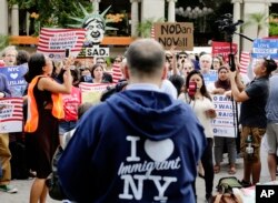 Protesters of a travel ban gather in Union Square, June 29, 2017, in New York.