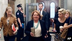 Sen. Heidi Heitkamp, D-N.D., arrives before a vote to advance Brett Kavanaugh's nomination to the Supreme Court, on Capitol Hill, Oct. 5, 2018 in Washington.