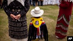 FILE - Traditional clothing is worn during an event to celebrate National Aboriginal Day in Winnipeg, Manitoba, June 23, 2011. More than 1 million Canadians are of Aboriginal origin, and the nation has more than 600 recognized First Nations governments.