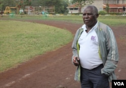 Coach John Mwithiga, who has been training top Kenyan athletes for 25 years, at a track in Nairobi, Kenya, Nov. 6, 2014. (Hilary Heuler / VOA News)