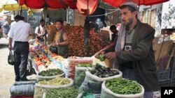 A street vendor sells food on the streets of the capital San'a, Yemen. Even in Yemen's breadbasket, people are having trouble feeding themselves in what food experts say is a hidden but growing hunger problem across this impoverished country, the poorest