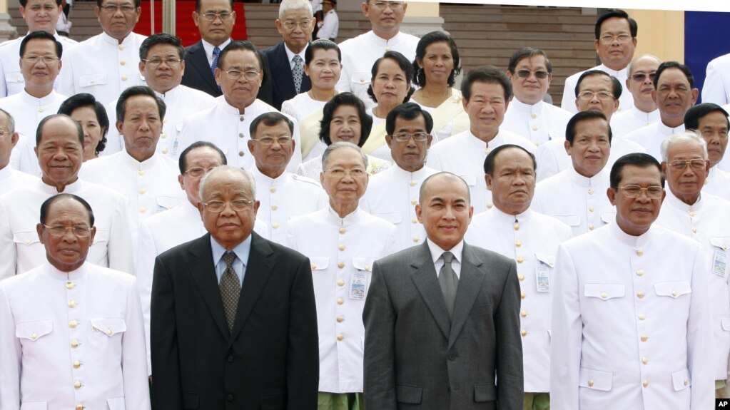 Cambodia's King Norodom Sihamoni, second right, poses for photograph altogether with Hun Sen, right, Cambodian Prime Minister, Chea Sim, second left, Cambodia Senate President, Heng Samrin, left, Cambodian National Assembly President, in front of the National Assembly in Phnom Penh, Cambodia, Wednesday, Sept. 24, 2008.