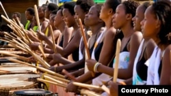 Rwanda's only female drumming troupe is made up of both Hutus and Tutsis, many of whom are still traumatized by the 1994 genocide. (Courtesy Lex Fletcher) 
