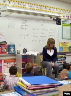 Teacher Sonja Pellerin with first and second-grade students at Hinkley School, which will soon close. (VOA/C. Richard)