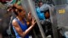 Unjuk Rasa Warga Venezuela Tuntut Pembagian Daging Babi