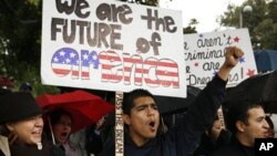 Undocumented college student Jorge Herrera, 18, center, of Carson, Calif., rallies with students and Dream Act supporters in Los Angeles, 18 Dec 2010.