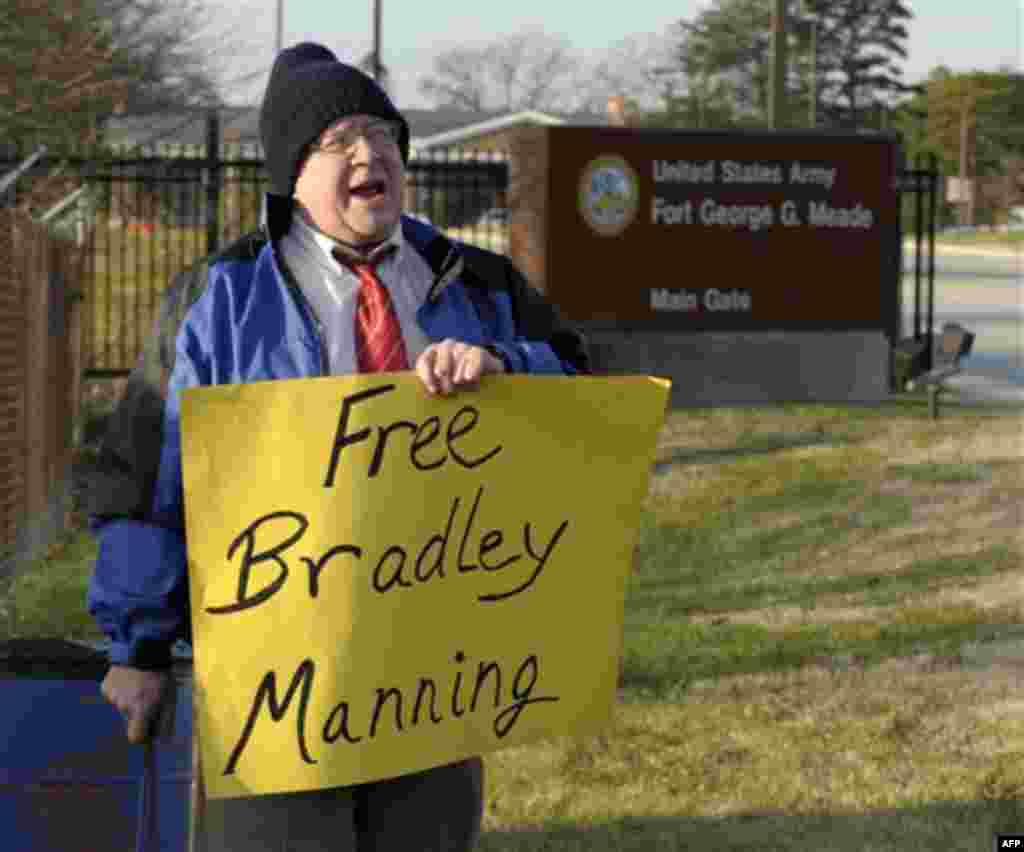 Dave Eberhardt of Baltimore, Md., protests outside Ft. Meade, Md., Friday, Dec. 16, 2011, in support Pfc. Bradley Manning. The U.S. military is making its case for why Manning should be court-martialed on charges of endangering national security by steali