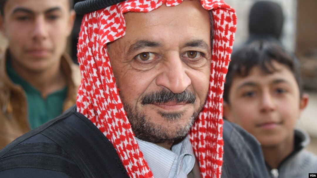 Sheikh Mohammad Abu Omar, a local leader in the village of Bashmana, says that before Hashd Shaabi captured their village, they feared sectarian violence from the predominantly Shia forces, but those fears have since been allayed Bashmana, Iraq, Dec. 16, 2016. (H. Murdock/VOA)