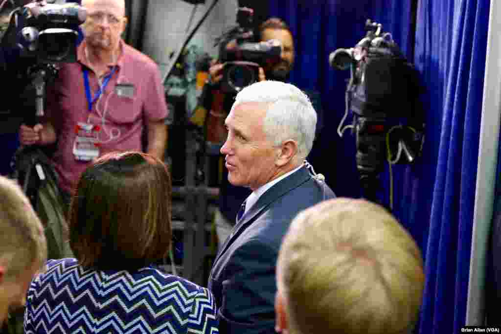 Republican Vice Presidential candidate Mike Pence speaks with Fox News in spin alley at Hofstra University prior to the first presidential debate (B. Allen/VOA)
