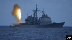 In a photo provided by the U.S. Navy, a Standard Missile-3 (SM-3) is launched from the Aegis cruiser USS Shiloh (CG 67), during a joint Missile Defense Agency, U.S. Navy ballistic missile flight test, off the coast of Kauai, Hawaii (File Photo)