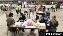 Kent State University Students get their COVID-19 vaccinations in Kent, Ohio, Thursday, April 8, 2021. (AP Photo/Phil Long)