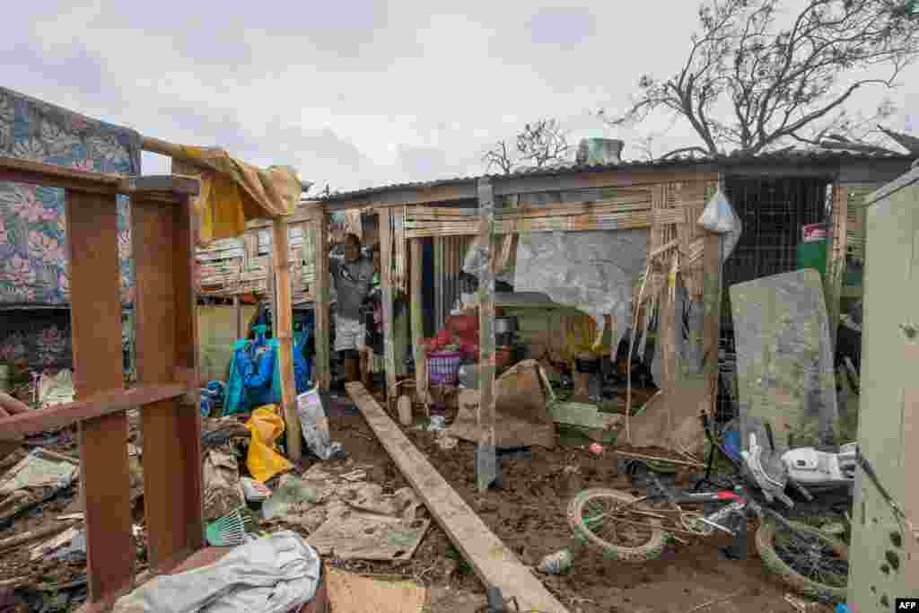 This handout photo taken and received on March 15, 2015 by UNICEF Pacific shows a resident&#39;s home badly damaged by Cyclone Pam, outside the Vanuatu capital of Port Vila.