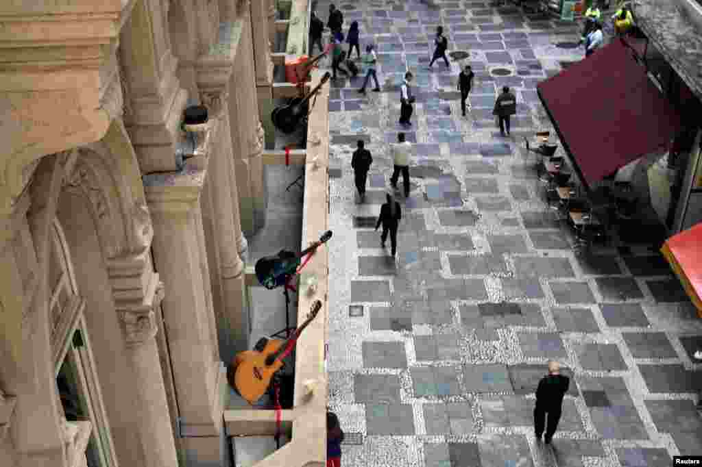 Guitars are displayed on the terrace of a building in downtown Sao Paulo, Brazil.