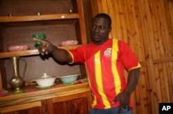 Isaac Donkor, in his Black Stars football jersey, inside his furniture store in Johannesburg