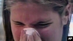 An allergy sufferer sneezes
