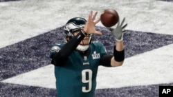 Philadelphia Eagles quarterback Nick Foles catches a touchdown pass during the first half of the NFL Super Bowl, Feb. 4, 2018, in Minneapolis. The play, called the "Philly Special," has turned into a city-wide phenomena. 