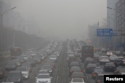 REUTERS Traffic in polluted weather of Beijing, China