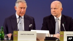 Prince Charles and British Foreign Secretary William Hague address a February meeting of 50 nations declaring a global end to ivory poaching.
