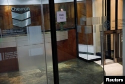 FILE - The logo of Chevron is seen in their office in Caracas, Venezuela, April 18, 2018.