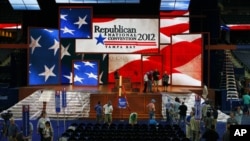 Workers prepare the stage for the Republican National Convention inside the Tampa Bay Times Forum, in Tampa, Florida, August 25, 2012.